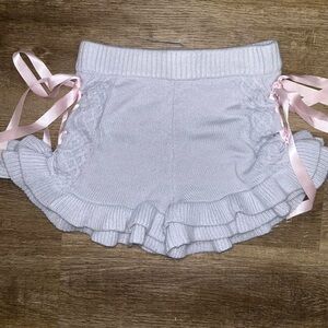 Dollskill Sugar Thrillz pastel blue and pink lace up shorts with ribbon ties